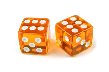 Two caramel color glass dice isolated on white background. Six and six with a shadow.