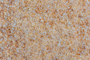 Bread crumb texture, top view. Abstract background of golden Breadcrumbs.