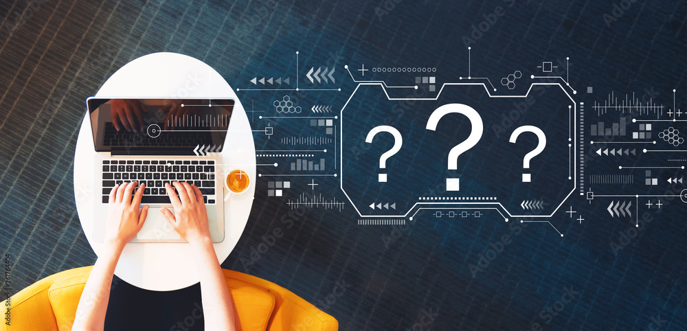 Poster question marks with person using a laptop on a white table
