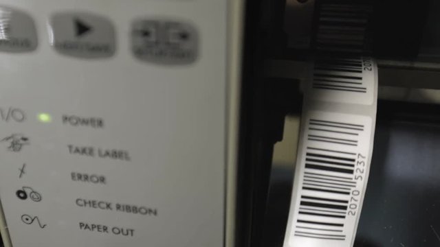 Closeup on barcode enterprise printer when printing barcode stickers