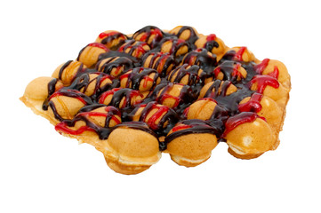 Sweet Hong Kong waffle with chocolate and jam on a white background, close-up