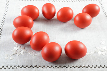 Colourful Easter eggs on ornated linen cloth