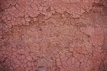 Dry cracking mud wall texture, natural background concept