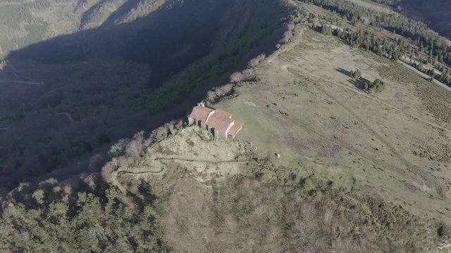 Hermitage in Kolitza peak in Balmaseda 290, Basque Country, Spain drone aerial footage - ungraded (graded version available)
