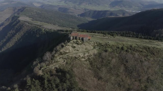 Hermitage in Kolitza peak in Balmaseda 299, Basque Country, Spain drone aerial footage - ungraded (graded version available)