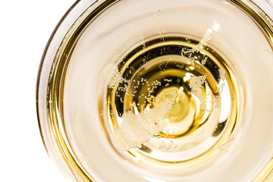 tiny bubbles in a champagne glass from above