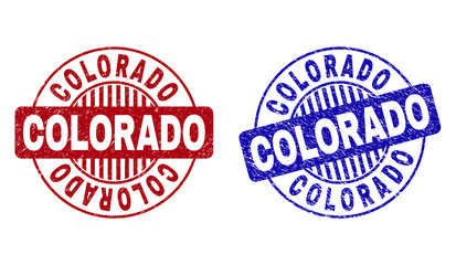 Grunge COLORADO round stamp seals isolated on a white background. Round seals with grunge texture in red and blue colors. Vector rubber overlay of COLORADO label inside circle form with stripes.