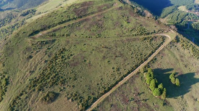 Hermitage in Kolitza peak in Balmaseda 338, Basque Country, Spain drone aerial footage - graded (ungraded version available)