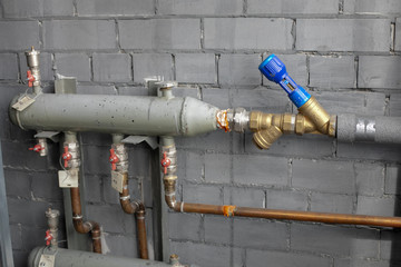 Turning on or turning off water supply in the boiler room. Plumbing concept.