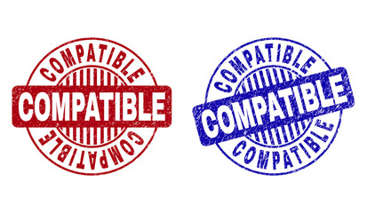 Grunge COMPATIBLE round stamp seals isolated on a white background. Round seals with grunge texture in red and blue colors. Vector rubber overlay of COMPATIBLE tag inside circle form with stripes.