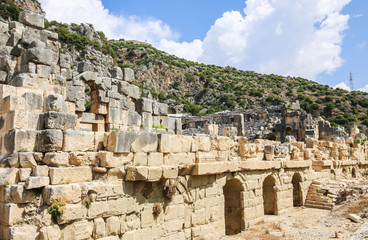 Fototapeta na wymiar amphitheater at the foot of the hill, in the foreground part of the wall and entrance