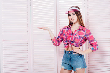 Beautiful woman cherleader posing on modern studio!