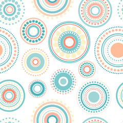 Seamless abstract pattern of circles and dots of orange and turquoise colors on white background.