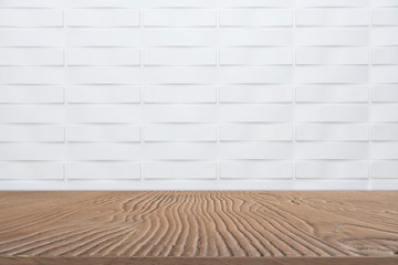 Abstract background from empty wooden tabletop for show product with white marble wall background.