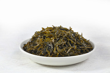 seaweed salad is a dietary product rich in iodine. on white background. 