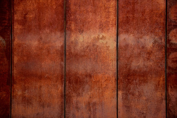 Background of a rusty corroded weathered metal wall, repeating pattern, vertical lines