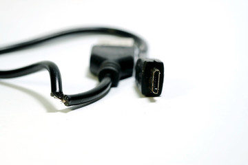 Isolate photo of damage USB cable on white background and space for write wording, consumable or connecting gadget using with smartphone or tablet, high risk of accident, burning and device quality