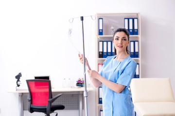 Young female doctor in infusion concept 