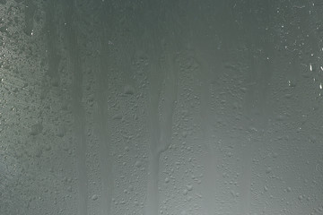 wet glass background condensate / abstract rain, drops texture on transparent glass