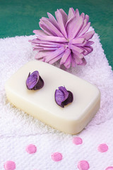 NATURAL SOAP TABLE ON COTTON TOWEL WITH PINK FLOWERS