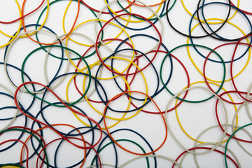 abstract background with colored rubber bands for money on a white background