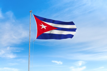 Fototapeta premium Cuba flag over blue sky background