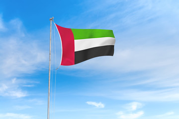 United Arab Emirates flag over blue sky background