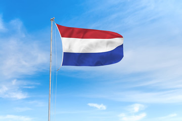 Naklejka na ściany i meble Netherlands flag over blue sky background