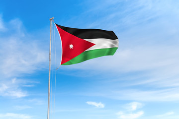 Jordan flag over blue sky background