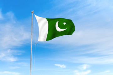 Pakistan flag over blue sky background