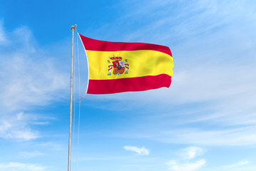 Fototapeta na wymiar Spain flag over blue sky background