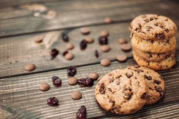 Oat cookies with chokolate drops on brown wooden background