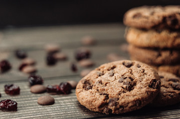 Chocolate cookies on dark wood background close up.