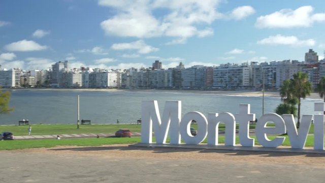 Montevideo Sign - Beach view, city skyline. Montevideo, Uruguay - Circa 2019