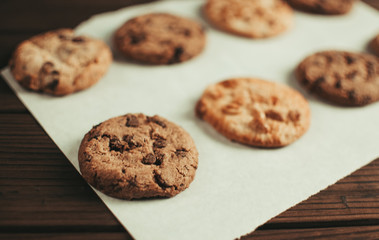 Close-up crunchy chocolate chip cookies laid on parchment