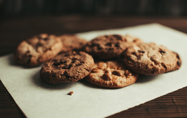 Stacked chocolate chip cookies shot with selective focus.