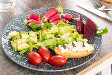 plate with vegetarian salad of natural organic vegetables
