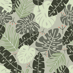 Seamless pattern with green tropical leaves. Vector design.
