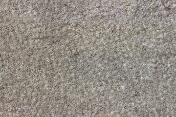 Texture of gray-yellow stone wall