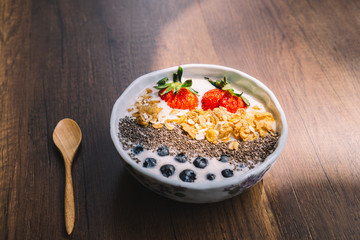Yogurt with strawberry, blueberry, chia seed and cornflake