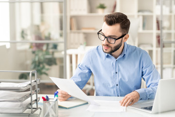 Man reading papers