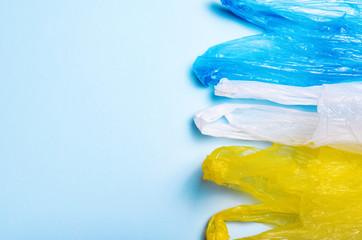 Plastic Bags on Blue Background, Recycle and Plastic Pollution Concept