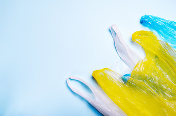 Plastic Bags on Blue Background, Recycle and Plastic Pollution Concept