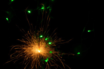 sparkler with blur new year's light close up