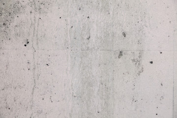 Fototapeta premium Texture background. Gray concrete wall with rough seams, mortar, plaster, abrasions, irregularities. Concept construction of country house, cottage, garage