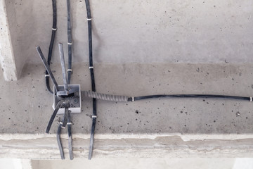 Cable laying the ceiling. Electrical wires on the wall. Wiring replacement. Connecting the light in the flat or office. Professional installation electrical outlets, wires and switches. Insulation