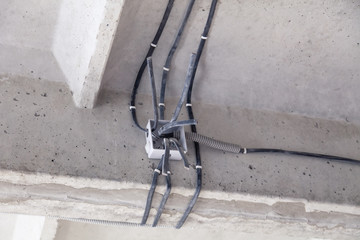 Cable laying the ceiling. Electrical wires on the wall. Wiring replacement. Connecting the light in the flat or office. Professional installation electrical outlets, wires and switches. Insulation