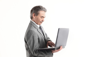 close up.adult businessman looking at laptop screen.isolated on white background