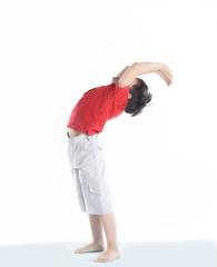 little boy performs an exercise the bridge .isolated on white
