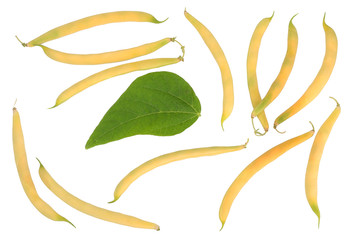Obraz premium yellow-green pods beans on white, top view
